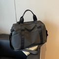 Black waterproof travel duffel bag with Come Knock logo and adjustable shoulder strap - Black