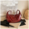 Dark red glossy leather crescent backpack with silver hardware and adjustable straps - Red
