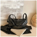 Versatile black crescent backpack in shiny oil wax leather with adjustable shoulder strap - Black