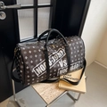 Large dark brown travel bag with white MOCO letter prints and adjustable shoulder strap - Black