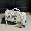 White duffle travel bag with star patterns and adjustable shoulder strap - White