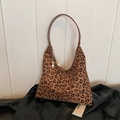Leopard print hobo shoulder bag with brown leather handle and beaded charm detail - Brown