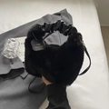 Chic black faux fur handbag with ruched leather handle and crossbody strap for winter - Black