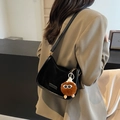 Chic black crescent underarm bag with a cute brown monster plush charm for women - Black