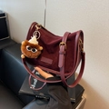 Vintage burgundy matte leather crossbody bag with a cute plush charm accessory - Burgundy