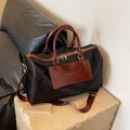 Bolso de viaje grande de nailon negro con ribete de cuero marrón y detalles metálicos plateados - Negro