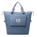 Vista frontal de la bolsa de viaje oxford azul gris con compartimento para zapatos y asas - Azul Niebla