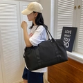 Large black waterproof nylon travel bag for women featuring HONGZ woven label - Black
