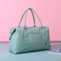 Waterproof mint green travel duffel bag with large capacity and woven brand label - Green