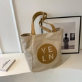Chic beige canvas tote bag with brown leather straps and minimalist logo patch - No Pendant / Off White