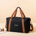 Black canvas fitness travel bag with brown straps and HAYUN logo on beige background - Versatile Black