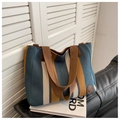 Detail of striped canvas tote bag with brown leather logo patch and nylon strap - Blue