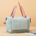 Mint green and pink large travel duffel bag with waterproof fabric and reinforced handles - Green