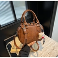 Brown PU leather vintage Boston bag with CIOH'2D embossing and bear pendant - Caramel color