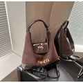 Detail of dark brown patchwork crossbody bag with dog pattern and MUHETI embroidery - Brown