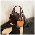 Dark brown patent leather Boston bag with a plush bear charm and twin top handles - Brown