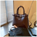 Women's deep red patent leather shoulder bag with glossy finish and silver fashion plate - Brown