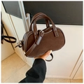 Dark brown minimalist leather pillow bag with dual handles and embossed fashion text - Coffee