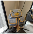 Chic blue denim mini backpack with brown leather trim and golden chain detailing - Denim / Blue