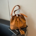 Vintage brown frosted suede bucket bag with drawstring closure and stylish long tassels - Brown
