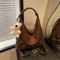 Dark brown convertible faux leather backpack with plush bear charm and fashion logo - Coffee (With Pendant)