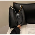 Detail of vintage black leather shoulder bag featuring geometric patchwork and metal buckle - Black