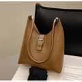 Detail of brown geometric patchwork leather shoulder bag with silver buckle and matte finish - Brown