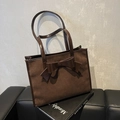 Deep brown faux suede tote bag featuring a large decorative bow and double handles - Coffee