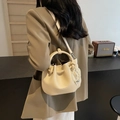 Chic beige pleated bucket bag with pearl charm and circular metal handle for women - Off-white