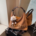 Brown suede tote bag with plush 'HOLIDAY' lettering and a cloud charm on a mirror - Brown