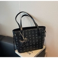 Close-up of litchi textured tote bag featuring cartoon bear monogram and metal buckle - Black (With Pendant)