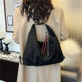Minimalist black faux suede hobo backpack with woven tassels and brass hardware - Black with Pendant