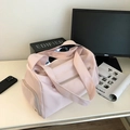 Detail view of pink waterproof yoga gym bag with large main compartment and side zipper - Pink