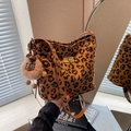Vintage leopard print bucket bag with golden buckle and brown plush bear charm - With Charm / Leopard Print