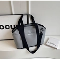 Detail of grey lightweight yoga tote bag with black straps and removable shoulder strap - Gray