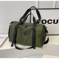 Detail view of military green waterproof nylon travel bag with durable straps and buckle - Green