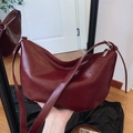 Deep red half-moon crossbody bag in glossy faux leather with adjustable strap - Red
