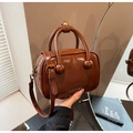 Brown glossy patent leather handbag with spherical handle links and adjustable shoulder strap - Brown