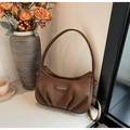 Detail of a brown pleated PU leather shoulder bag with a stylish Fashion metal label - Coffee