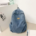 Classic denim blue backpack with leather logo patch and convenient side pockets - Light Blue