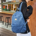 Stylish deep blue denim backpack for women featuring a vintage washed texture and casual look - Dark Blue