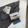 Chic silver quilted chain bag with metallic finish and circular clasp closure - Silver Small