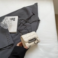 White quilted mini chain bag featuring a gray circular buckle on a stylish blazer - White Small