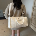 Large capacity cream PU leather travel bag with wide fabric strap and embossed logo - Off White