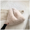 Detail of soft cream faux fur tote bag showing plush texture and slouchy design - White