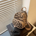 Mini leopard print backpack in faux pony hair with brown leather straps and gold zippers - Khaki