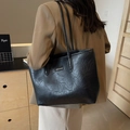 Classic black tote bag with wrinkled texture and slim shoulder straps for daily use - Black
