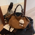 Brown vintage canvas tote bag with deep brown handles and a white cloud plush charm - Brown