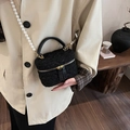 Mini black tweed bucket bag featuring elegant pearl shoulder strap and gold-tone zippers - Black