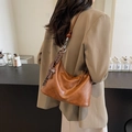 Minimalist caramel brown shoulder bag for women with cute charm and adjustable strap - Brown